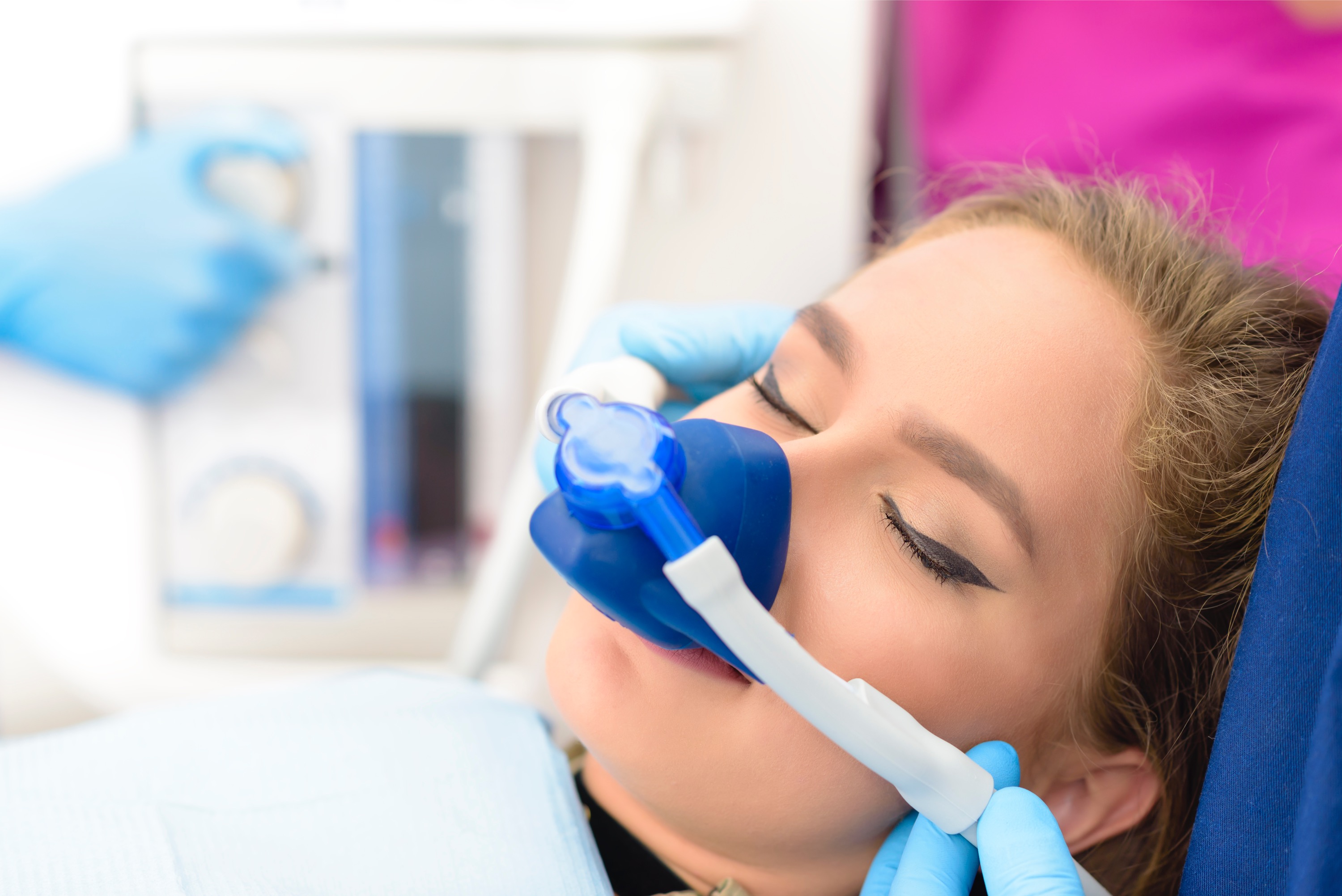 Dentist treating patient in dental chair